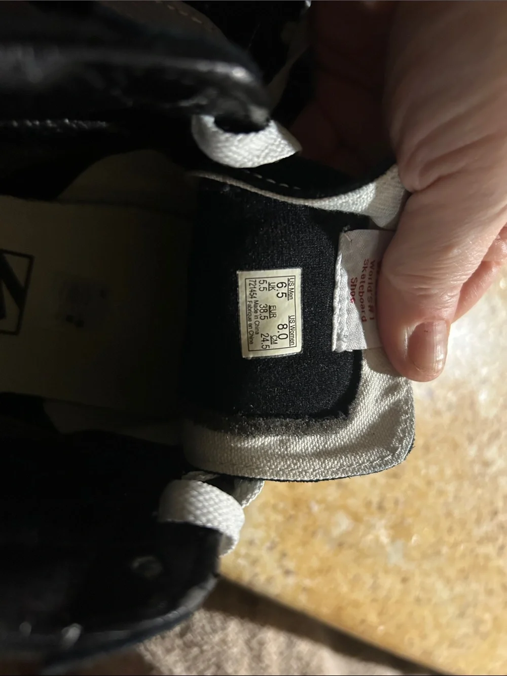 Vans women’s Black and White High-Top Skate Sneakers